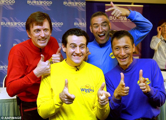 Sam Moran in yellow with members of The Wiggles